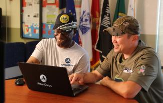 Two AmeriCorps Volunteers at Laptop